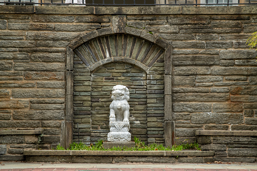 Swarthmore, USA - April 8, 2023. Lion statue in the campus of Swarthmore College, Pennsylvania, USA