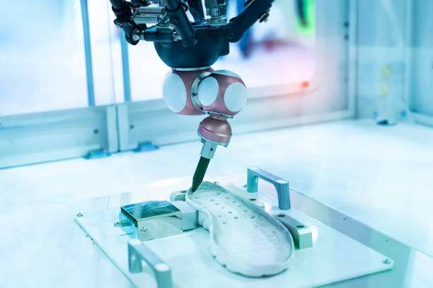 istock Robot holding glue syringe Injection on shoe 1495247244