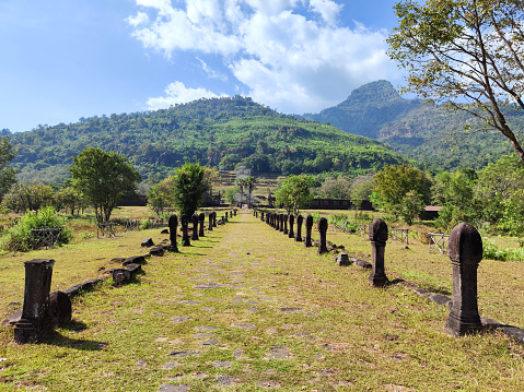 Causeway to Vat Phou, a ruined Khmer Hindu temple complex in southern Laos and one of the oldest places of worship in Southeast Asia. It is at the base of mount Lingaparvata, some 6 kilometres from the Mekong in Champasak Province.