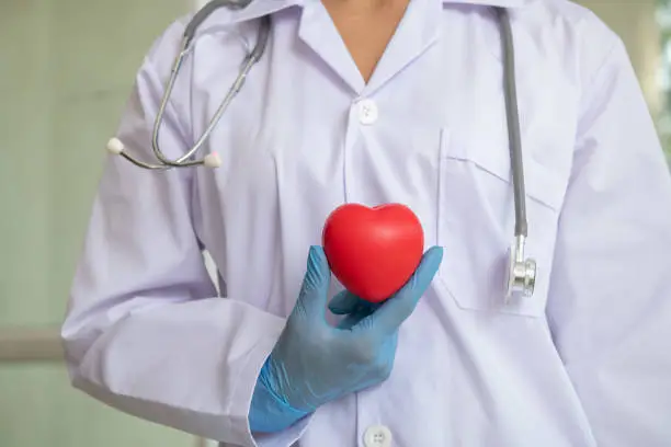 Photo of healthcare and medical concept - female doctor with heart, close-up. Perfect medical service in hospital. Medicine and healthcare concept
healthcare, technology and medicine - smiling female doctor.