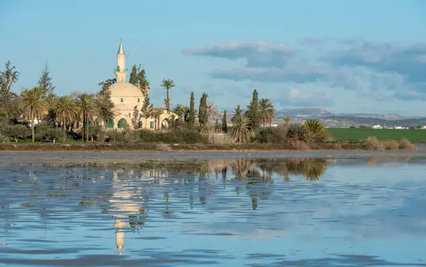 Photo of Hala Sultan Tekke or Mosque of Umm Haram religious muslim shrine at Larnaca Salt Lake in Cyprus.