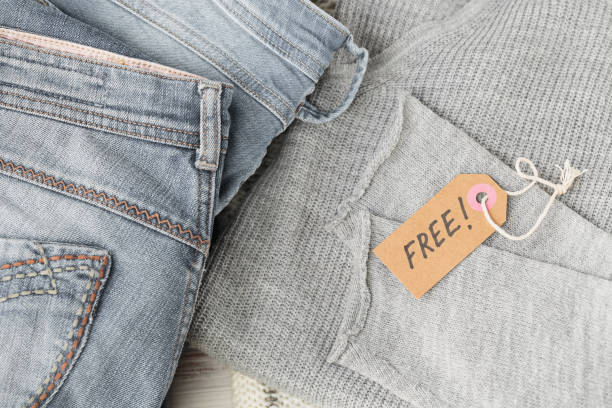 istock Stack of gray jeans and tag with inscription free 1495248691