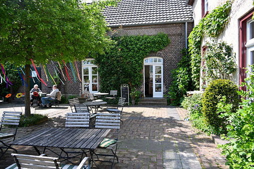 Kleve, Germany, May 17, 2023 - Terrace of Café im Gärtchen, a farm cafe in Kleve.