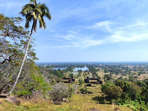 View towards the Mekong river from the upper level at Vat Phou sanctuary, a ruined Khmer Hindu temple complex in southern Laos and one of the oldest places of worship in Southeast Asia. It is at the base of mount Lingaparvata, some 6 kilometres from the Mekong in Champasak Province.