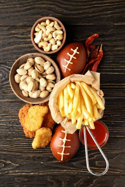 istock Concept of Super bowl snacks on dark background 1495249140