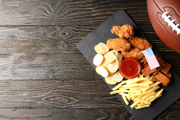 istock Concept of Super bowl snacks on dark background 1495249460