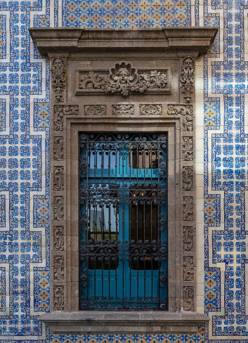 House of Tiles (Casa de los Azulejos) exterior facade with window and tin glazed ceramic, Mexico City, Mexico.