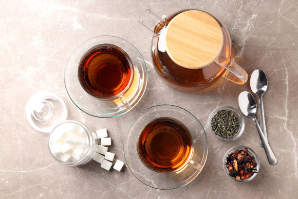 istock Concept of hot drink with tea on beige textured background 1495258579