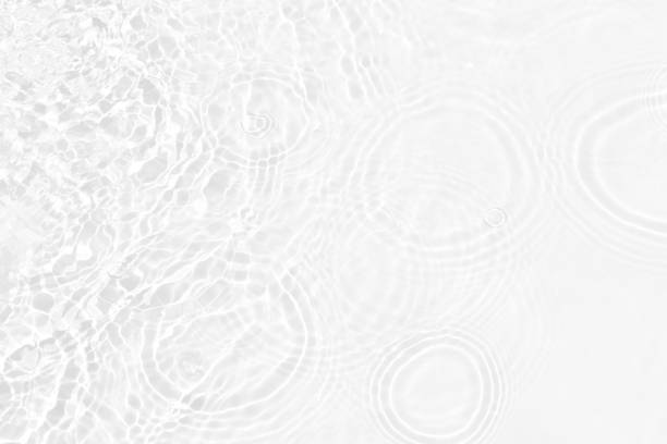 istock White water with ripples on the surface. Defocus blurred transparent white colored clear calm water surface texture with splashes and bubbles. Water waves with shining pattern texture background. 1495258761