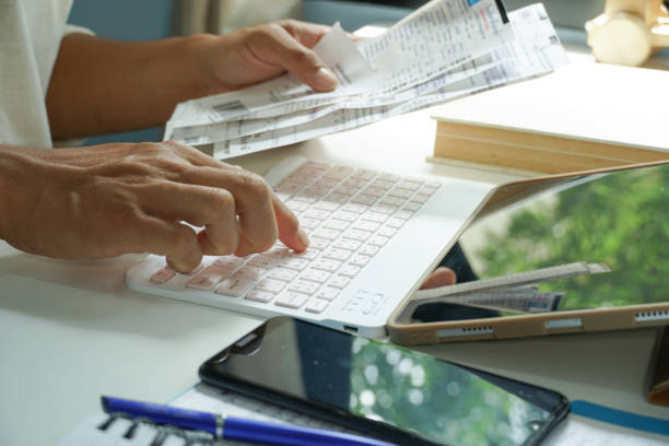 istock Asian men calculate bills each month to estimate spending. 1495259748