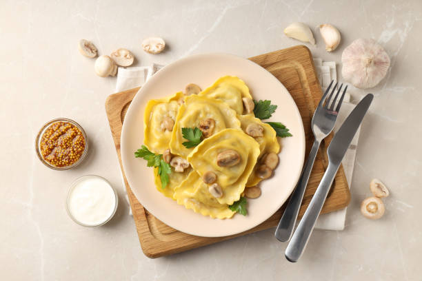 istock Delicious food concept with ravioli on textured table 1495261578