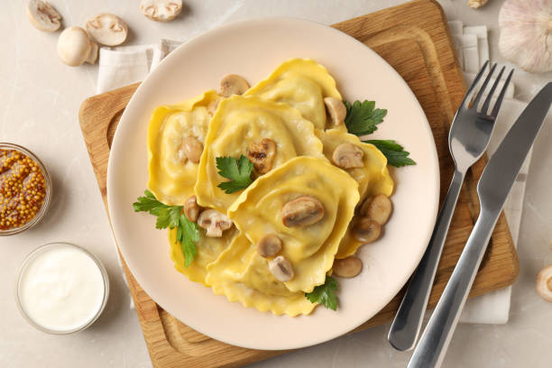 istock Delicious food concept with ravioli on textured table 1495261580