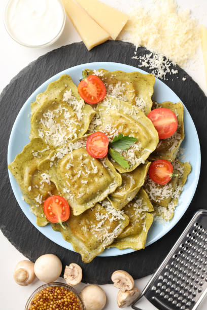 istock Delicious food concept with ravioli on white background 1495262873