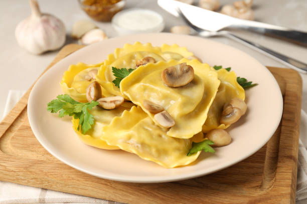 istock Delicious food concept with ravioli on textured table 1495263088