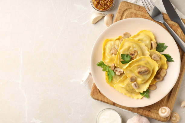 istock Delicious food concept with ravioli on textured table 1495263428