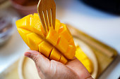 A close-up photo shows a ripe, sweet mango cut into bite-sized pieces beautifully ready to be served.