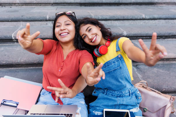portrait of two young latin girls university students in Mexico Latin America, hispanic girls studying stock photo