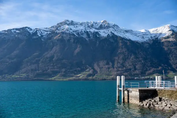 Mountain and lake in Iseltwald at Lake Brienz in Switzerland.