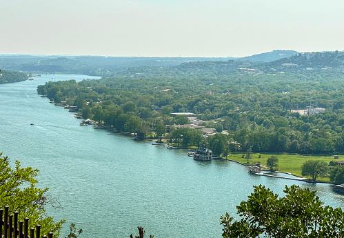 View from Mount Bonnell of the Colorado river and luxury houses in Austin, Texas.
