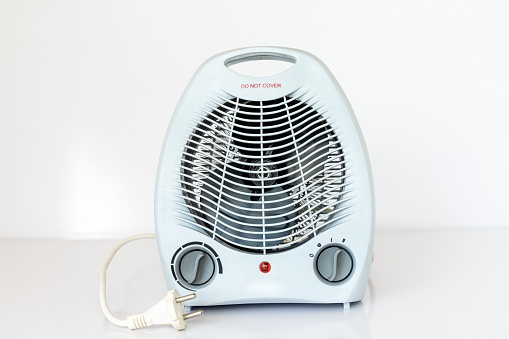 Electric fan heater on white isolated background
