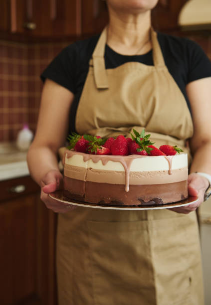 istock Details: Triple chocolate sweet layered mousse dessert decorated with ruby pink chocolate glaze and fresh strawberries 1495273531