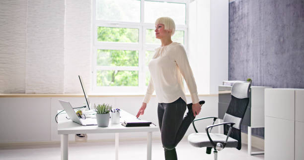 istock Yoga Workout In Office Behind Business Computer 1495275435