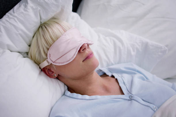 istock Young Woman Sleeping With Sleep Mask 1495275840