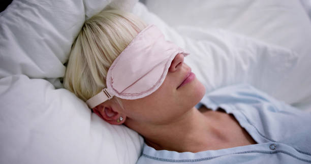 istock Young Woman Sleeping With Sleep Mask 1495275842