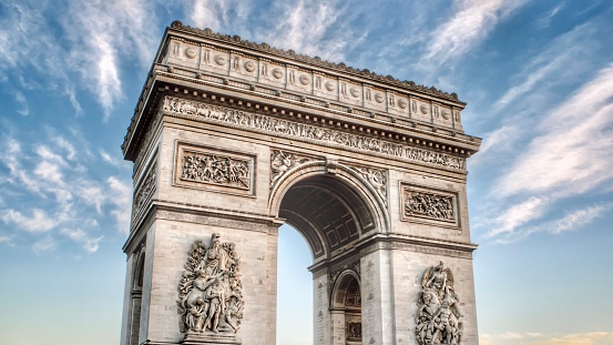 A close-up shot of the iconic Arc de Triomphe located in Paris, France