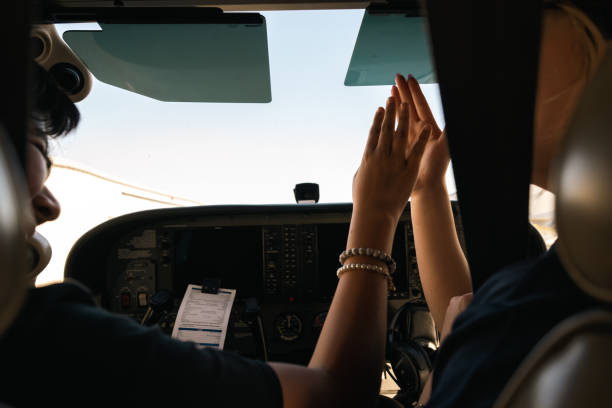 istock A boy is taking his first flight class and high-fives with his instructo 1495281495