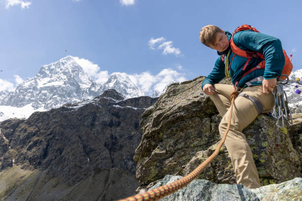 istock Mountain climber chooses gear for protection 1495281806