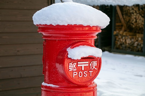 A Japanese mailbox covered with snow