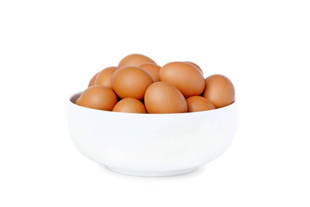 istock Fresh raw eggs from farm in bowl isolated on white background. 1495282722