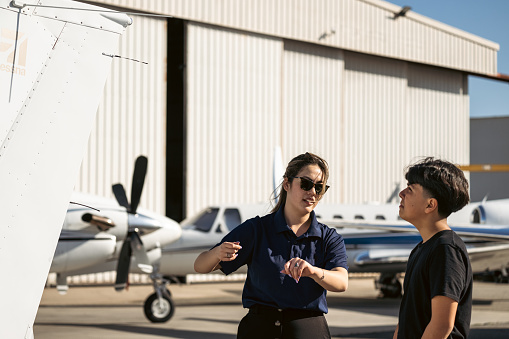 The youngster trying to absorbs the knowledge of becoming a pilot.