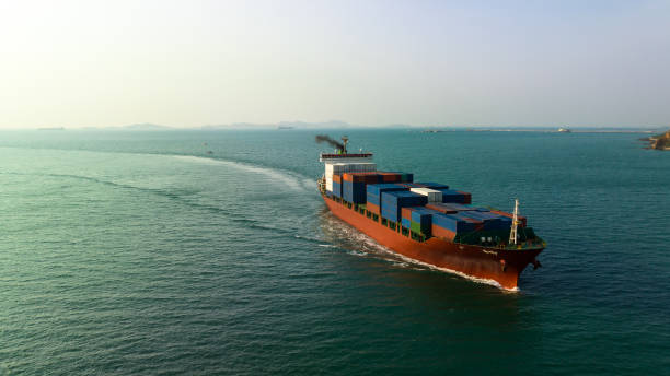 istock cargo container ship carrying in sea to import export goods and distributing products to dealer and consumers across asia pacific worldwide, global business and industry delivery service  by container ship Transport. 1495285072