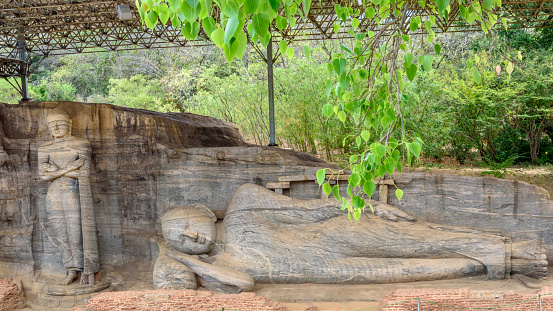 Statues of the sleeping and standing buddha in Gal Vihara Temple, Polonnaruwa, Sri Lanka