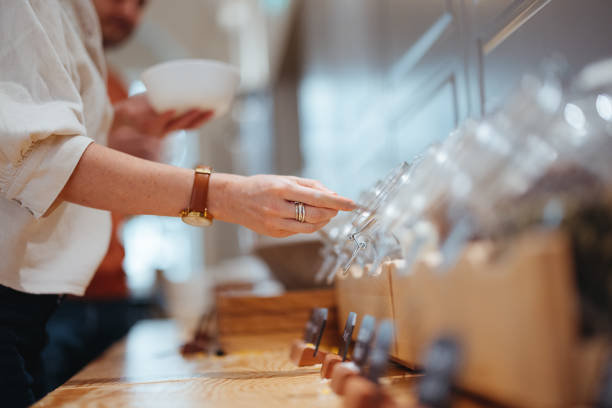 istock Anonymous Woman Scooping Oats for Her Breakfast at the Hotel 1495291040