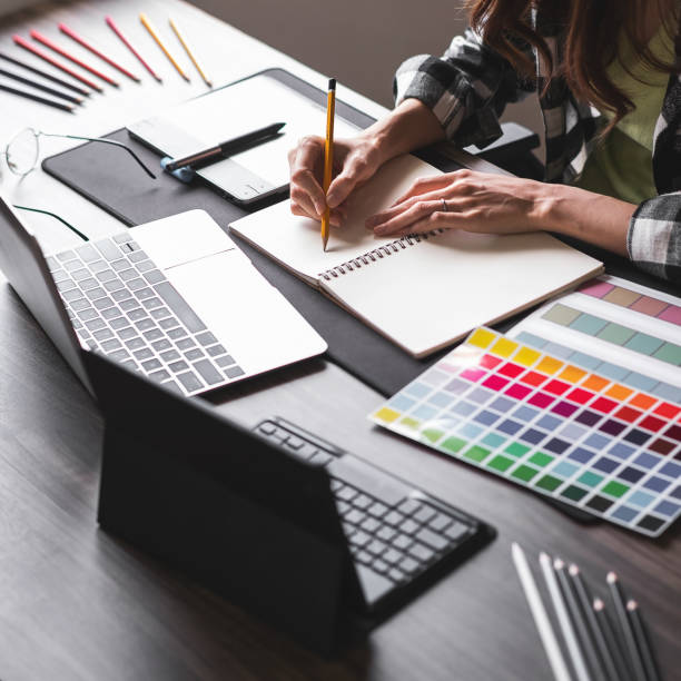 istock Graphic designer working with sketching logo design at office. 1495292568
