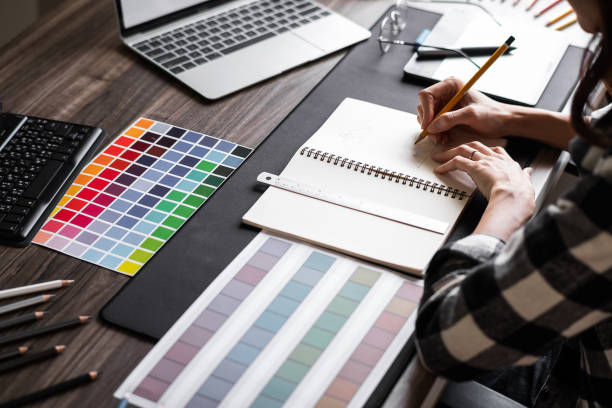 istock Graphic designer working with sketching logo design at office. 1495292605