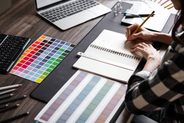 Graphic designer working with sketching logo design at office. stock photo