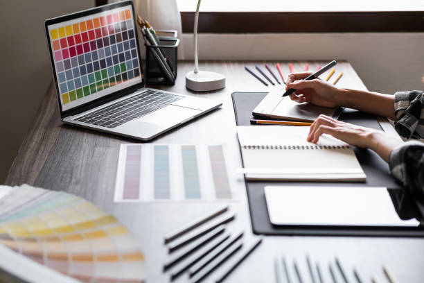 istock Graphic designer working with sketching logo design at office. 1495292615