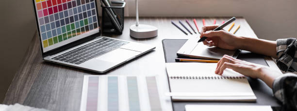 istock Graphic designer working with sketching logo design at office. Banner design 1495292619