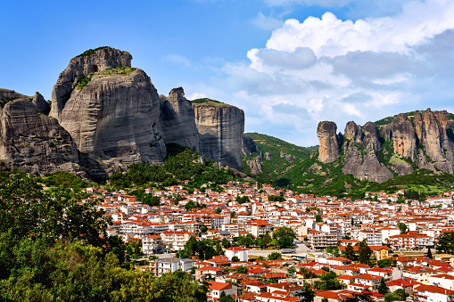 View of Kalampaka and Kastraki villages at foot of Meteora cliffs and pillars on sunny spring day. Greece, UNESCO World Heritage.