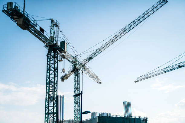 istock Construction site banner background. Construction industry and business concept. Cranes on a blue background. 1495304675