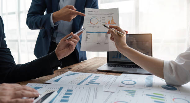 istock Business team analyzing income charts and graphs with modern laptop computer. Business analysis and strategy concept 1495305499