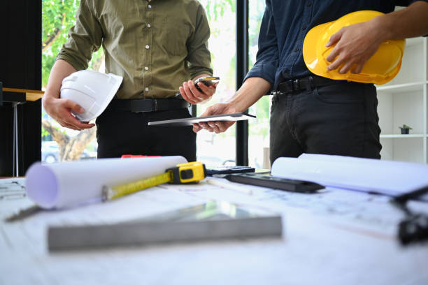 istock Engineer or Architects team collaborating, planning working together at co working space in office. 1495306442