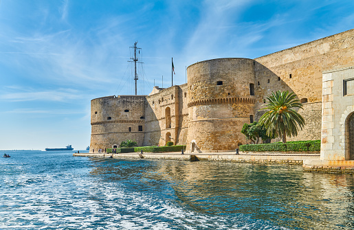 Taranto, Italy - November 2, 2022:The Aragonese castle seen from the sea