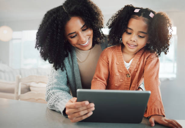 istock Tablet, happy family mother and kid online e learning, remote education or child development on home school technology. Elearning study, parent and youth kindergarten student with knowledge software 1495309758