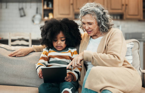 istock Elearning tablet, grandparent and African boy with remote education for child development in online school. E learning gesture, adoption family love and kindergarten student with knowledge software 1495310099