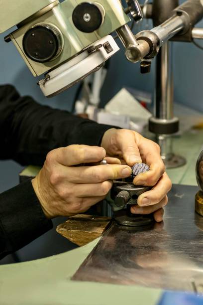 istock Hands of a jeweler with a ring. 1495319066